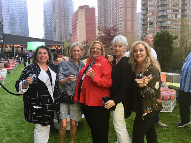 Franchise brokering Natalie Barnes poses with four brokers at IFA event in New York City